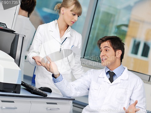 Image of science people in bright lab