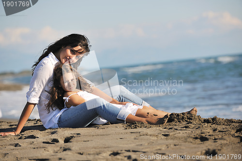 Image of mom and daughter portrait on beach