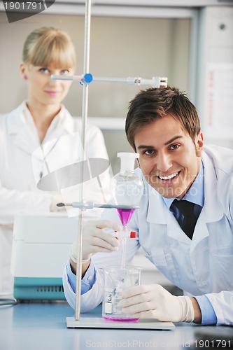 Image of science people in bright lab