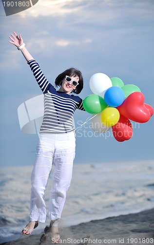 Image of young woman relax  on beach