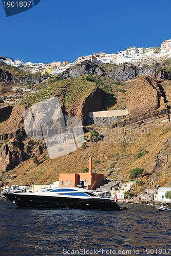 Image of santorini island coast with luxury yacht