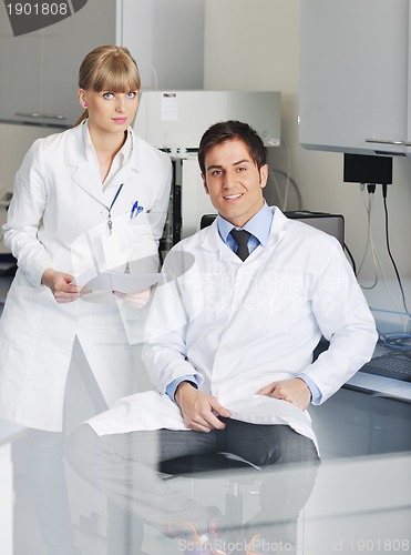 Image of science people in bright lab