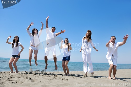 Image of happy young  people group have fun on beach