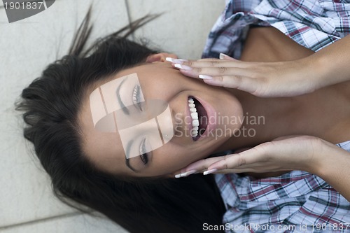 Image of beautiful young lady posing in garden