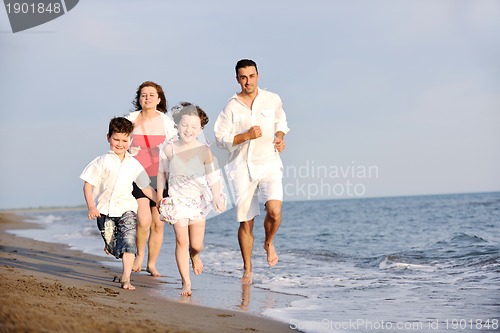 Image of happy young family have fun on beach