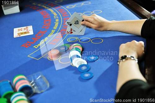 Image of woman play black jack card game in casino