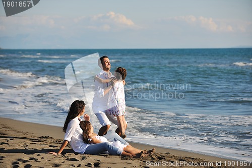 Image of happy young  family have fun on beach