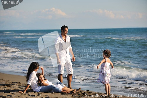 Image of happy young  family have fun on beach