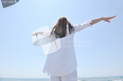 Image of young woman relax  on beach