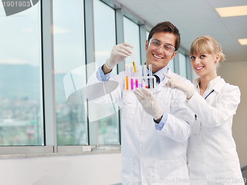 Image of science people in bright lab
