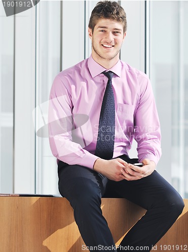 Image of young business man talk by cellphone