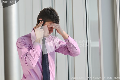 Image of young business man talk by cellphone