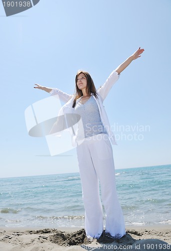 Image of young woman relax  on beach