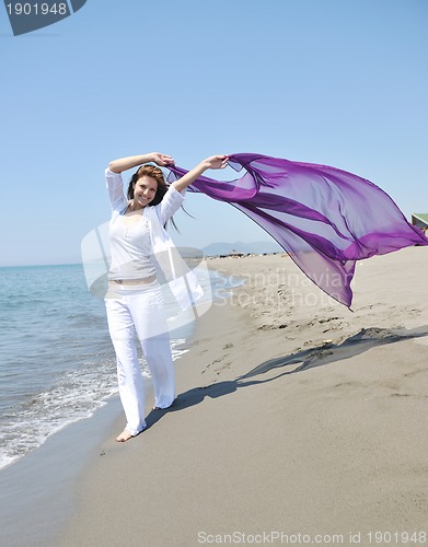 Image of young woman relax  on beach