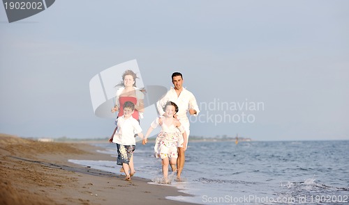 Image of happy young family have fun on beach