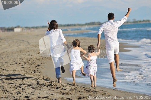 Image of happy young  family have fun on beach