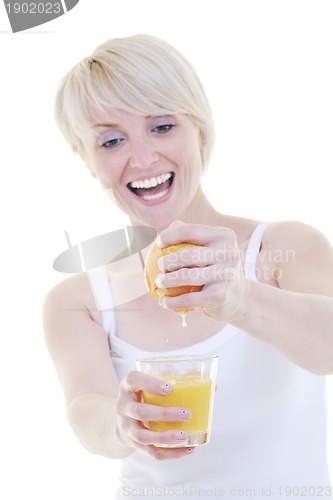 Image of Young woman squeeze orange juice