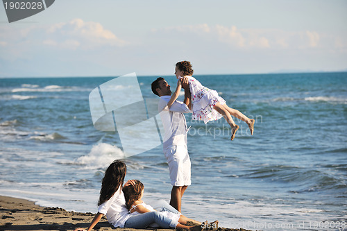Image of happy young  family have fun on beach