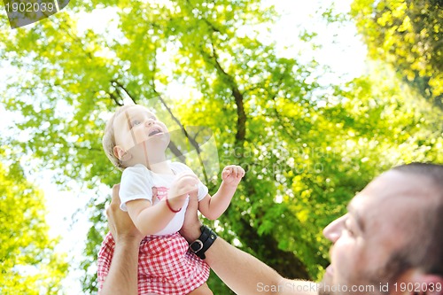 Image of man and baby playing in park