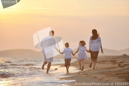 Image of happy young family have fun on beach
