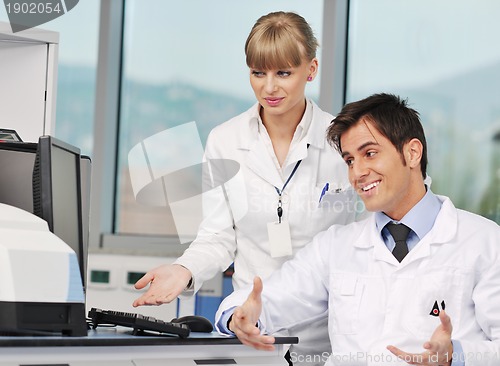 Image of science people in bright lab
