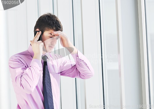 Image of young business man talk by cellphone