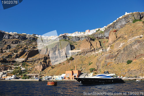 Image of santorini island coast with luxury yacht