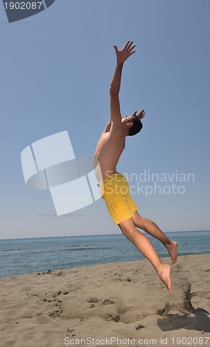 Image of male beach volleyball game player