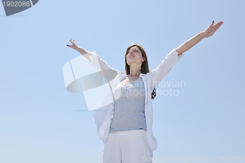 Image of young woman relax  on beach