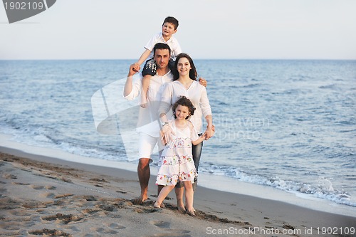 Image of happy young family have fun on beach