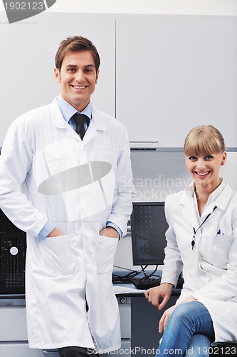 Image of science people in bright lab