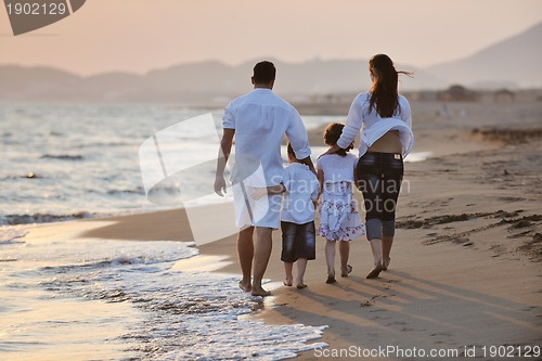Image of happy young family have fun on beach