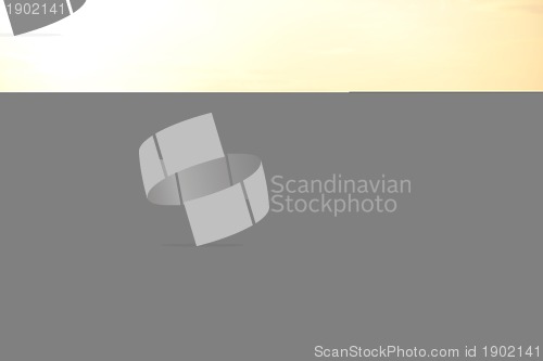 Image of happy young family have fun on beach at sunset