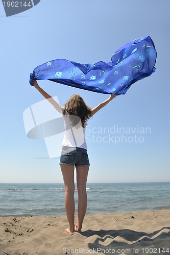 Image of young woman enjoy on beach