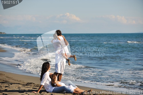 Image of happy young  family have fun on beach