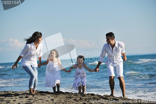 Image of happy young  family have fun on beach