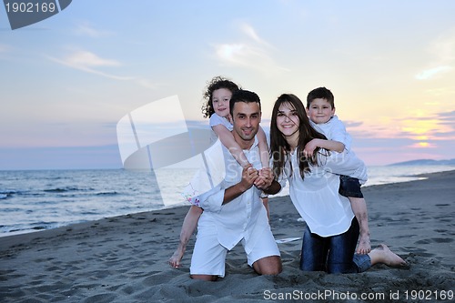 Image of happy young family have fun on beach