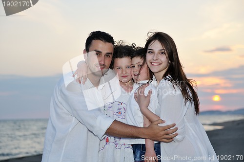 Image of happy young family have fun on beach
