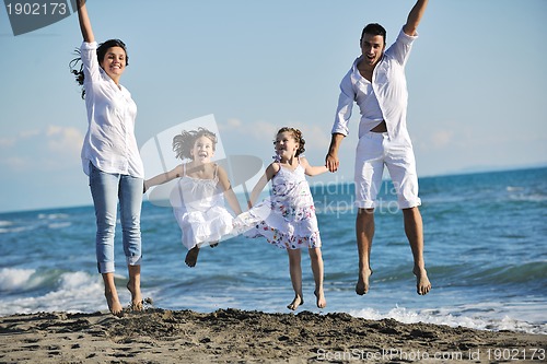 Image of happy young  family have fun on beach