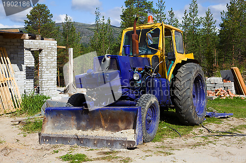 Image of Old tractor on a construction site