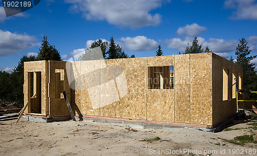 Image of Building a house of wood blocks