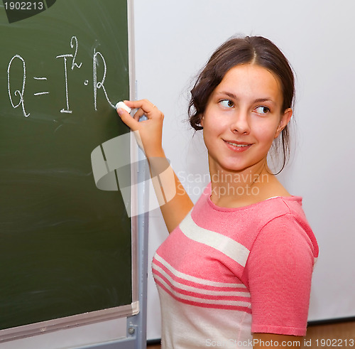 Image of Beautiful girl in a physics class