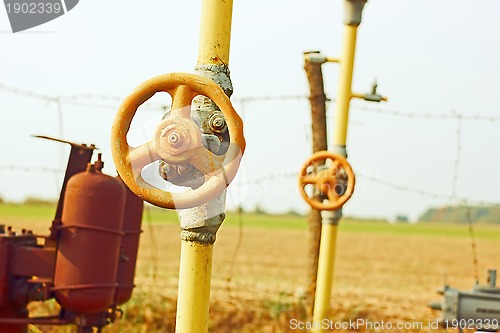 Image of Natural gas station among fields