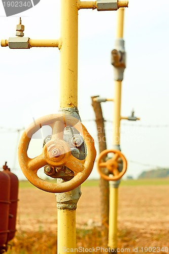 Image of Natural gas station among field