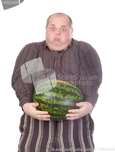 Image of Fat man struggling to hold the weight of a whole watermelon