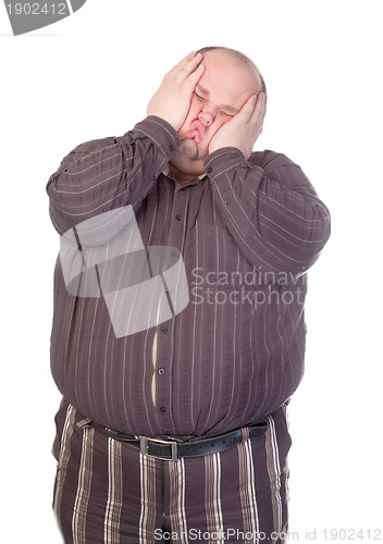 Image of Obese man squashing his face