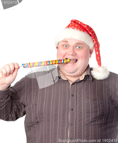 Image of Cheerful fat man in Santa hat