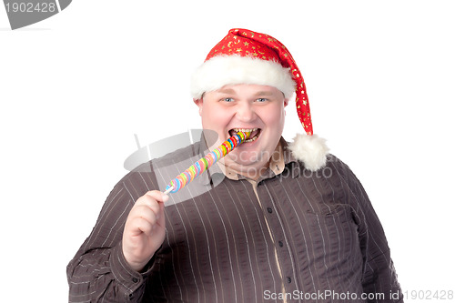Image of Cheerful fat man in Santa hat