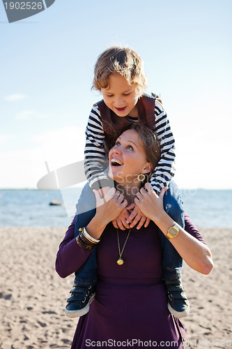 Image of Mother and son at beach.