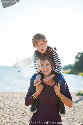 Image of Mother and son at beach.